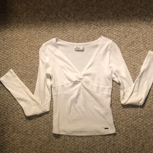 Adorable Hollister white long sleeve top. Beautiful detail with twist at bust.